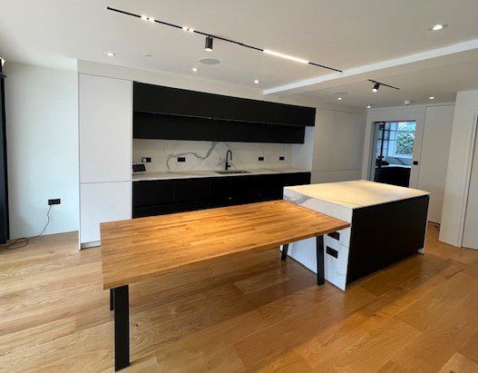 Sustainable kitchen design featuring wooden floors and counters